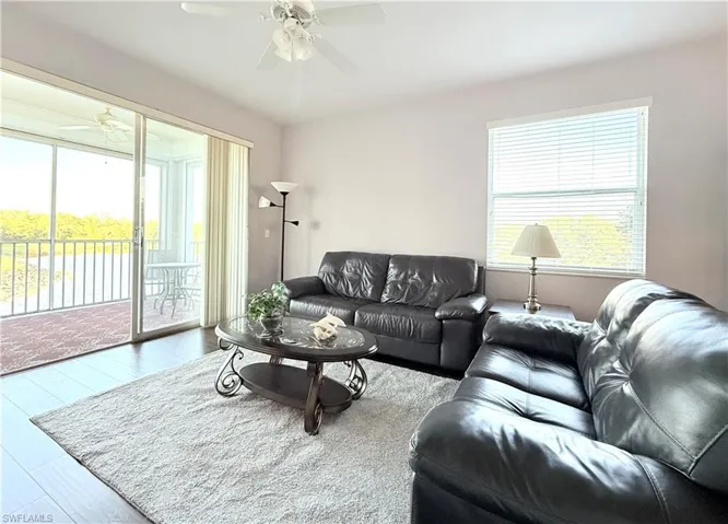 Living Room With Side Windows And Sliders To Back Lanai