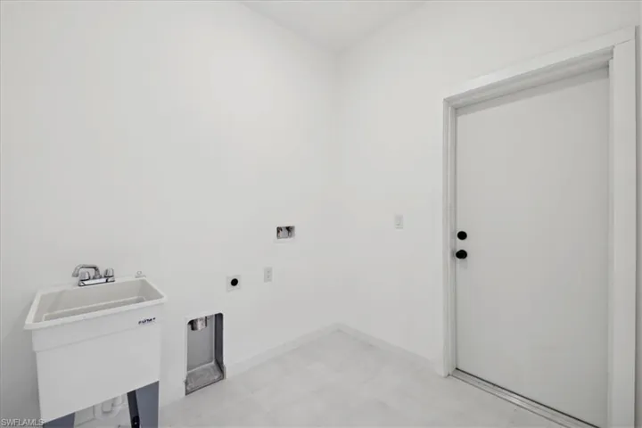 Laundry area featuring washer, electric dryer included