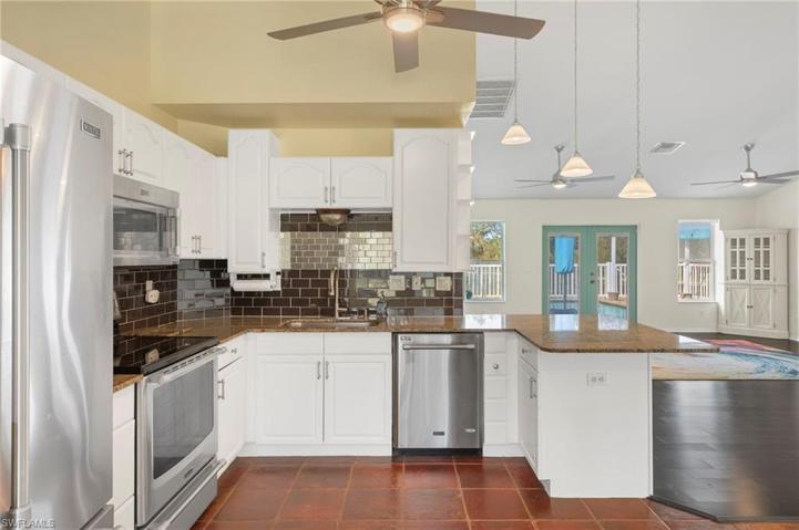 Granite countertops and stainless steel appliances.