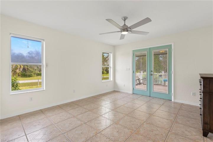 French doors lead to small front porch to enjoy your morning coffee.