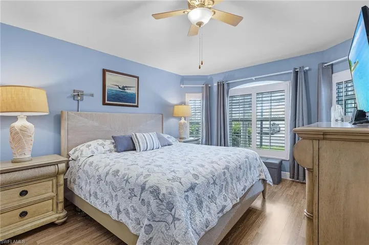 Bedroom featuring hardwood / wood-style flooring and ceiling fan