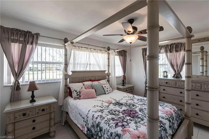 Bedroom with tile patterned flooring and a ceiling fan