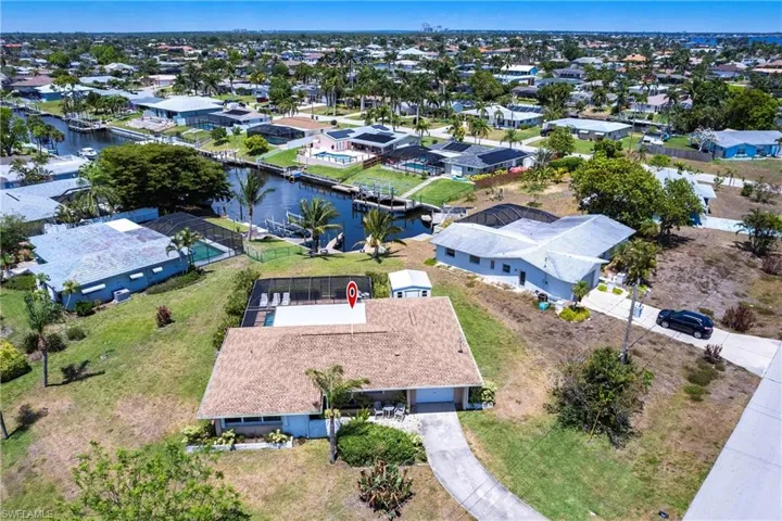 Aerial perspective of suburban area with canal and river view