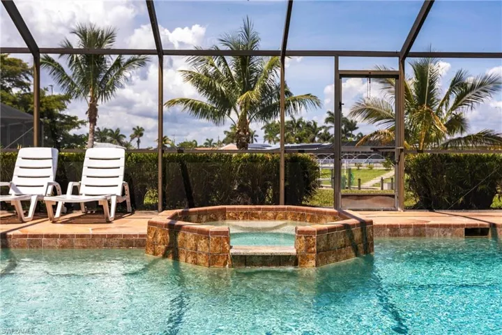 View of pool with hot tub