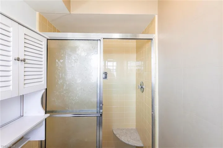 Full bathroom with a stall shower
