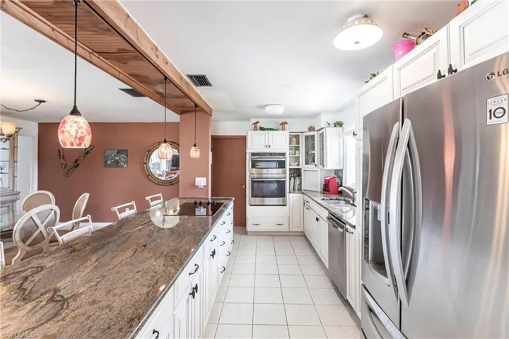 Spacious remodeled kitchen with newer appliances  and large breakfast bar