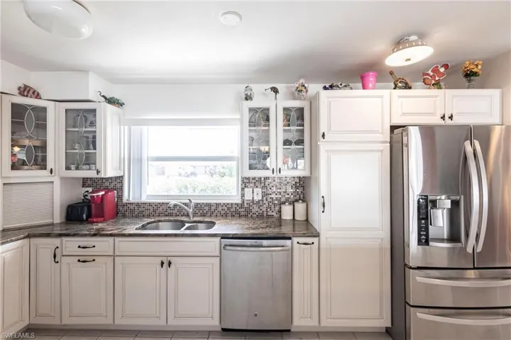 Spacious remodeledkitchen with newer appliances and granite counter tops
