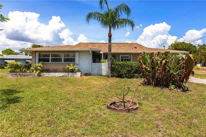 Ranch-style home with a front yard