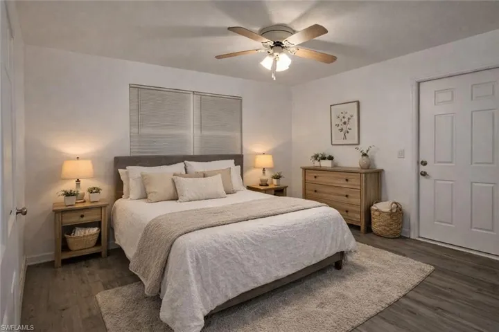 Bedroom featuring dark wood finished floors and a ceiling fan
