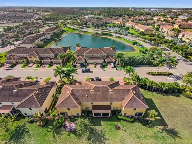 Aerial perspective showcasing a residential community with a central water feature