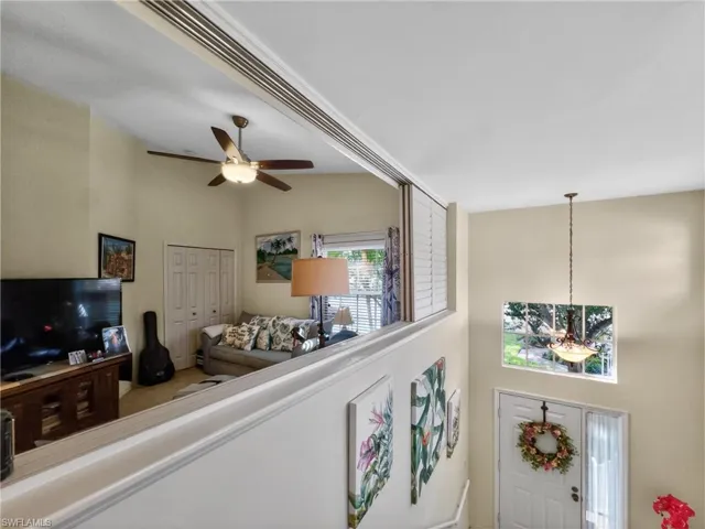 View of sliding shutters allowing more natural light to Den/Bedroom. 3rd Bedroom currently used as a Den.