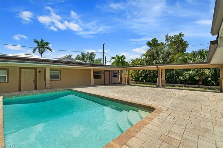 Outdoor pool with a patio