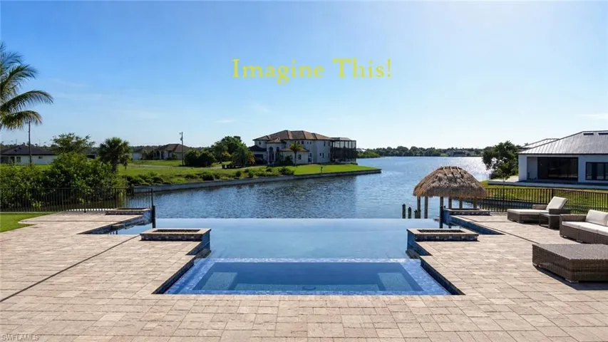 IMAGINE IF THIS WERE YOUR POOL......a paver deck, fire pits, and canal frontage with a private dock and tiki hut