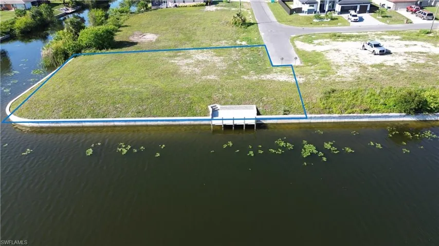 Oversized corner lot  with city utilities in place.  Ready for you to build.
