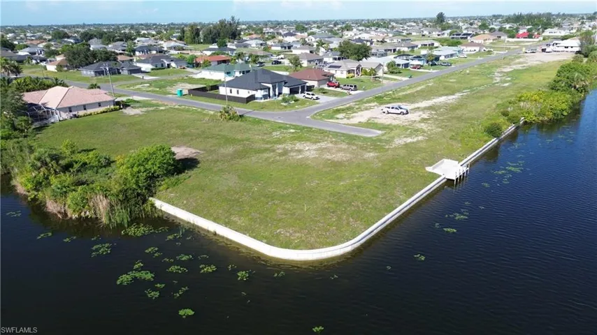 Waterfront lot featuring existing concrete seawall AND a private dock