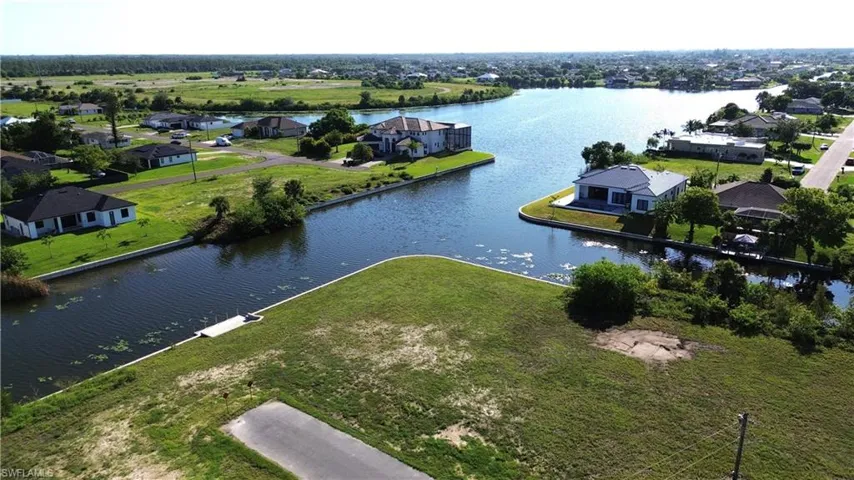 Waterfront property featuring canals on two side AND Lake Views AND private boat dock