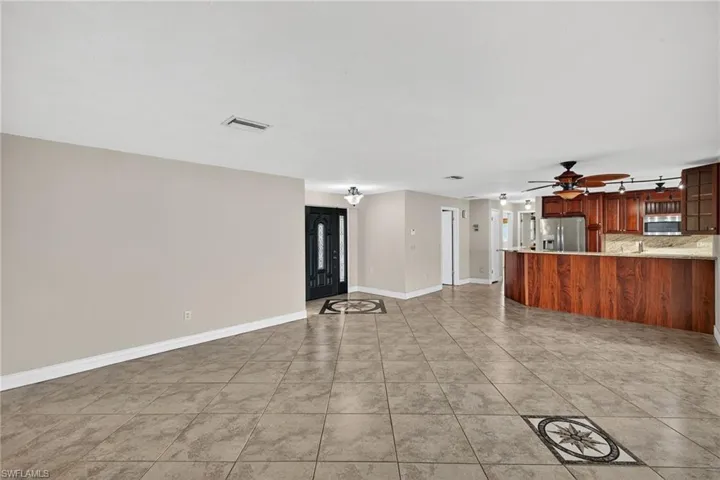 Large living room for entertaining looking into your stunning kitchen