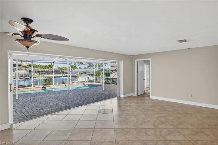 Sliders in Living Room open completely with amazing view of the +200' canal