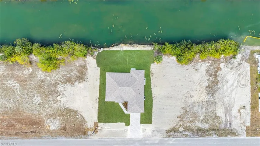 View from above of property with a large body of water