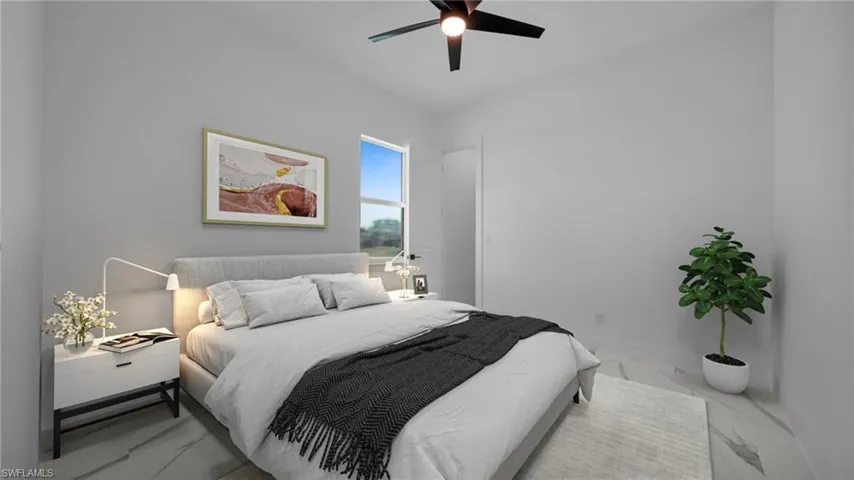 Bedroom featuring ceiling fan and marble finish floors Virtual Staged
