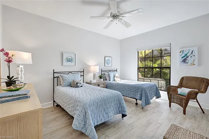 Bedroom featuring light wood-style flooring and ceiling fan