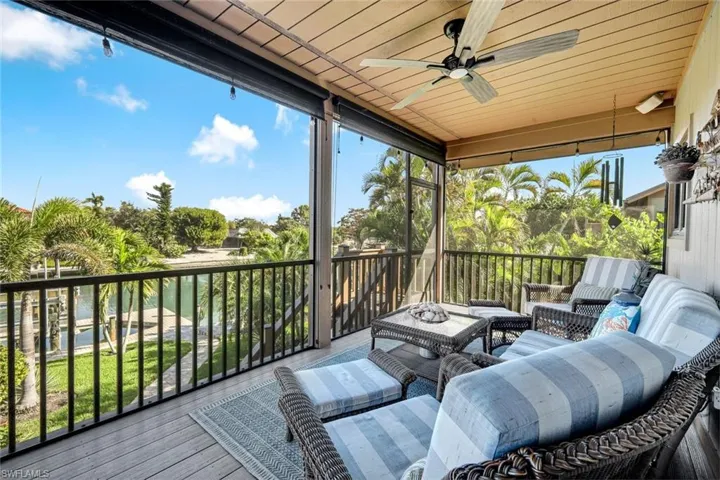 Sunroom / solarium featuring a ceiling fan and an outdoor hangout area