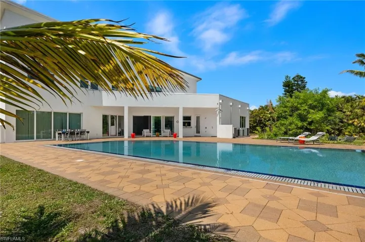 Outdoor pool featuring a patio
