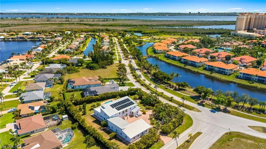 Drone / aerial view featuring a water view and a residential view