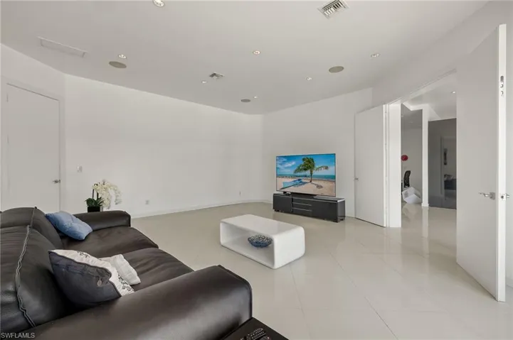 Living area featuring recessed lighting, visible vents, and light tile patterned flooring