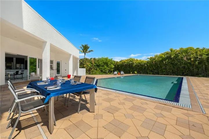 Pool featuring a patio and outdoor dining space
