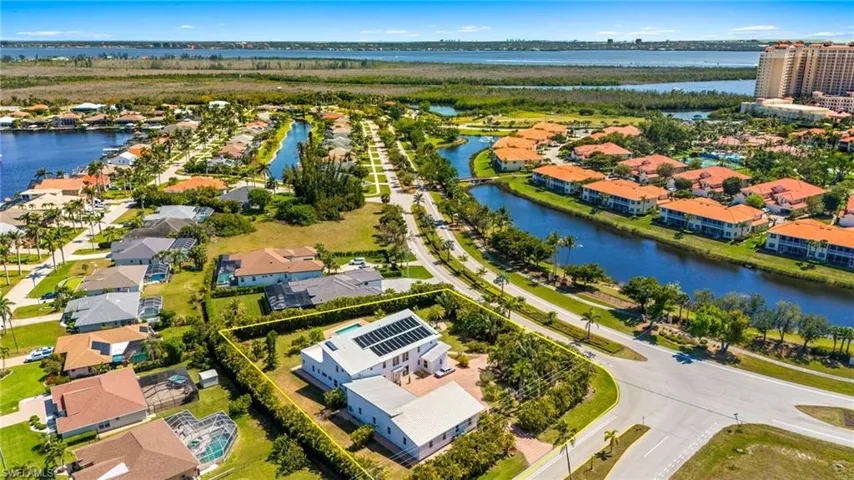 Birds eye view of property featuring a residential view and a water view