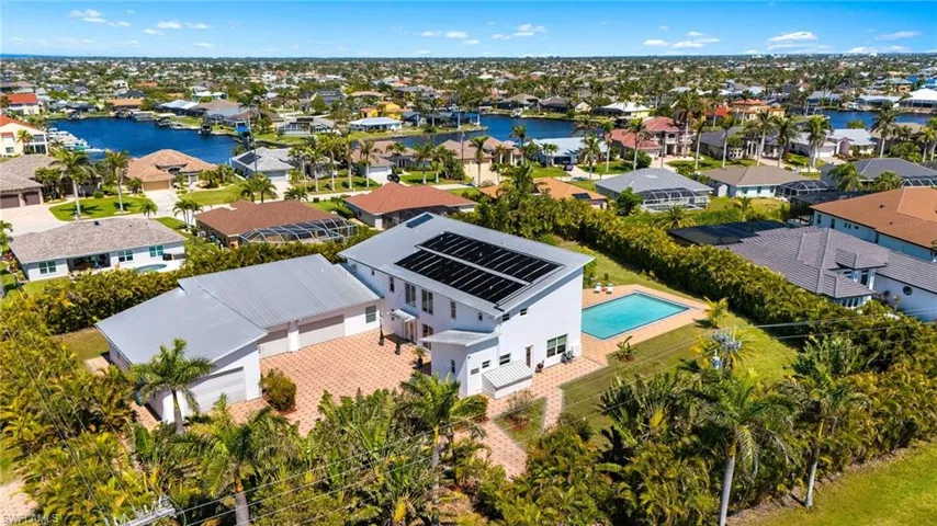 Drone / aerial view featuring a water view and a residential view
