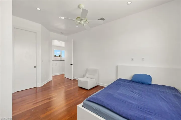 Bedroom with visible vents, baseboards, recessed lighting, wood finished floors, and a ceiling fan
