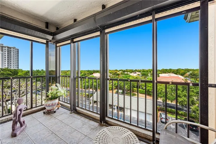 Unfurnished sunroom featuring expansive windows and a textured ceiling