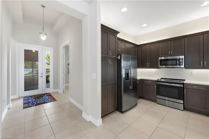 Kitchen showing foyer
