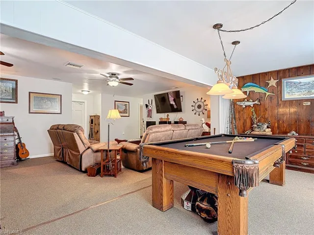 Recreation room featuring ceiling fan, carpet, billiards, and visible vents