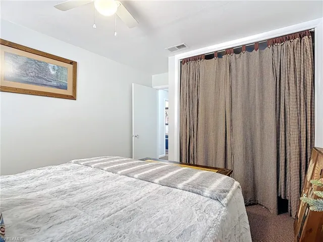 Bedroom featuring ceiling fan and visible vents