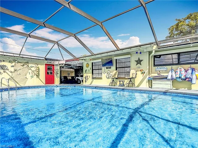 Outdoor pool featuring glass enclosure