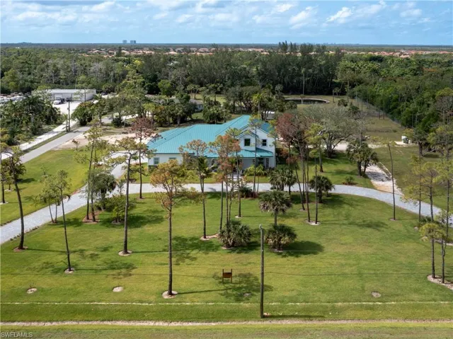 View of property's community featuring a lawn