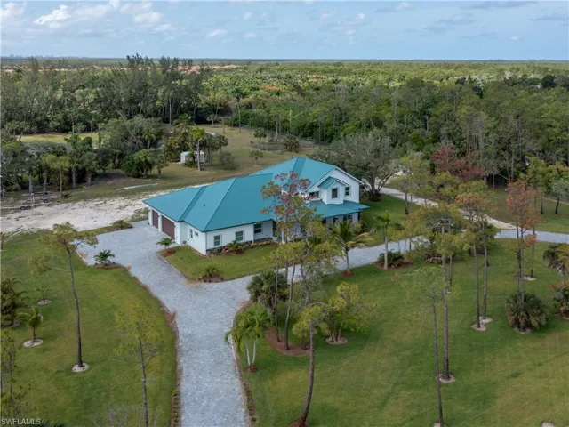 View from above of property featuring a forest