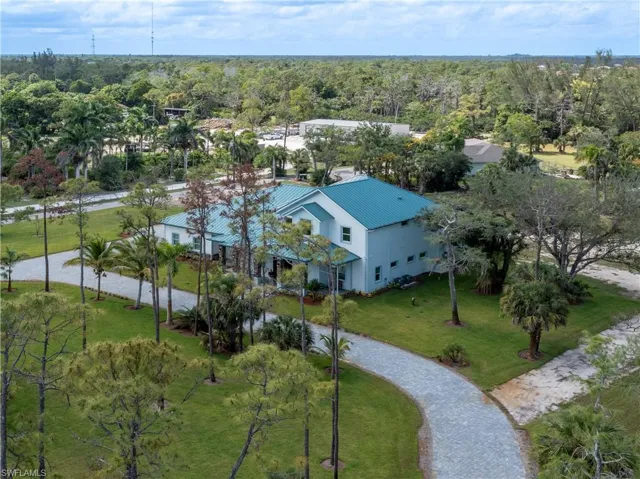 View of subject property with a heavily wooded area