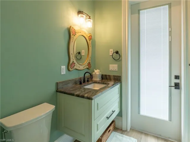 Bathroom featuring vanity and toilet
