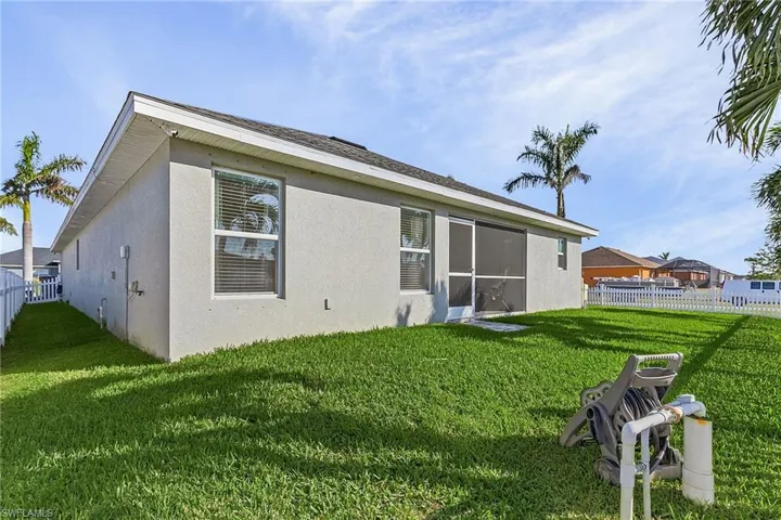 Rear view of house with stucco siding