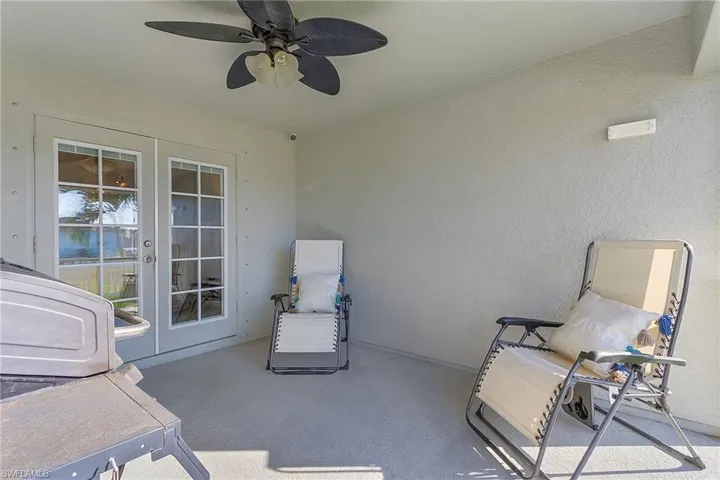 View of patio / terrace with french doors and ceiling fan