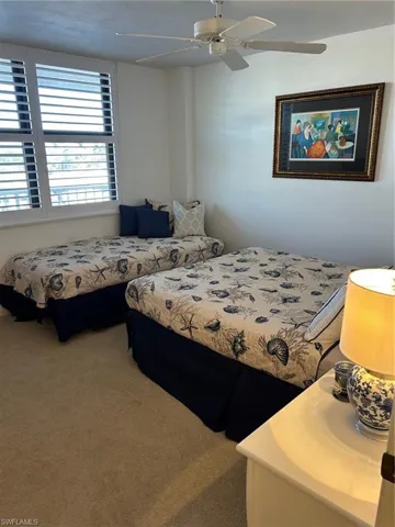 Bedroom with carpet and ceiling fan