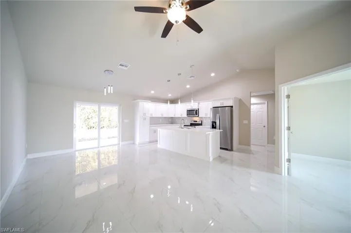 Large Living Room-Dining Area With Double Sliders That Lead Out To The Covered Lanai!