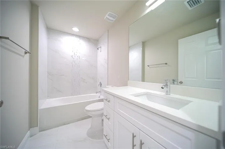 The Spare Bathroom Has Custom Tiled Area Over The Tub/Shower, Quartz Countertops, And Soft Touch Cabinet Doors And Drawers!