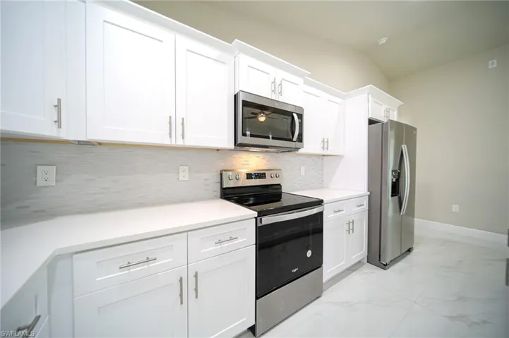 The Island Kitchen Comes With Quartz Countertops, Soft Touch White Wood Shaker Cabinets, Stainless Steel Appliances, Tile Backsplash, Floor To Ceiling Pantry, And Modern Lighting!