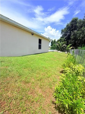 Stucco exterior with a single window