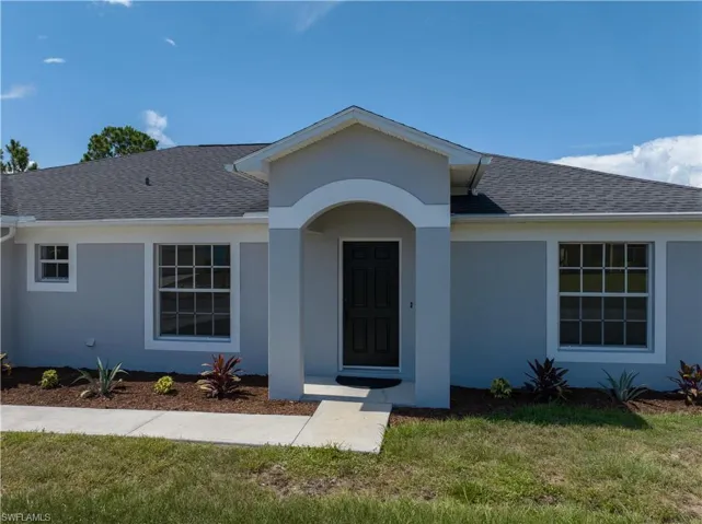View of front of house with a front yard